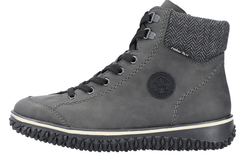 A gray ankle boot with black laces, a herringbone collar, and a black treaded sole.