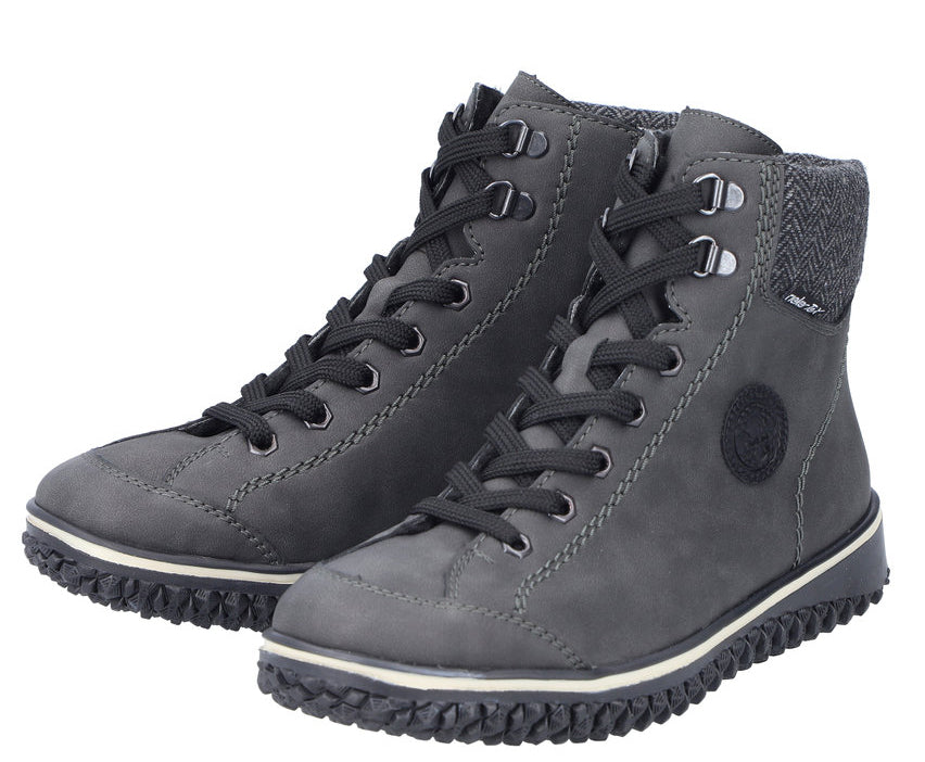 Pair of dark gray ankle-high lace-up boots with light-colored soles.