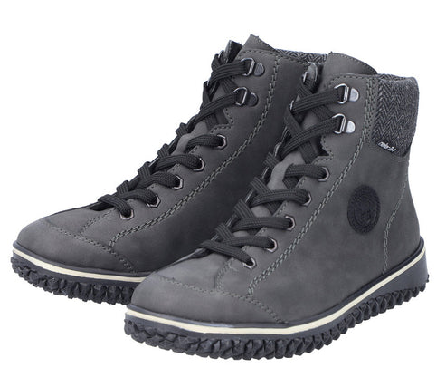 Pair of dark gray ankle-high lace-up boots with light-colored soles.