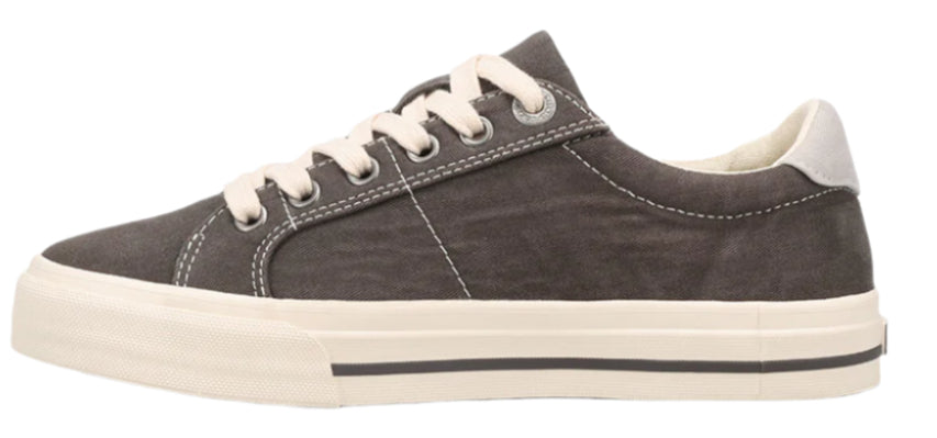 A low-top canvas shoe with a white sole and laces.