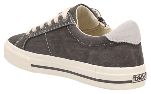 Charcoal gray canvas sneaker with white laces and sole and heel accent, sole has "tãos" logo.