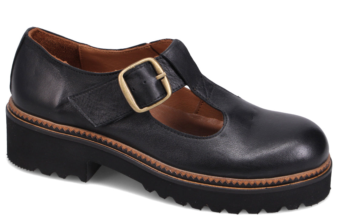 Black leather Mary Jane style shoe with a chunky lug sole and a gold buckle.