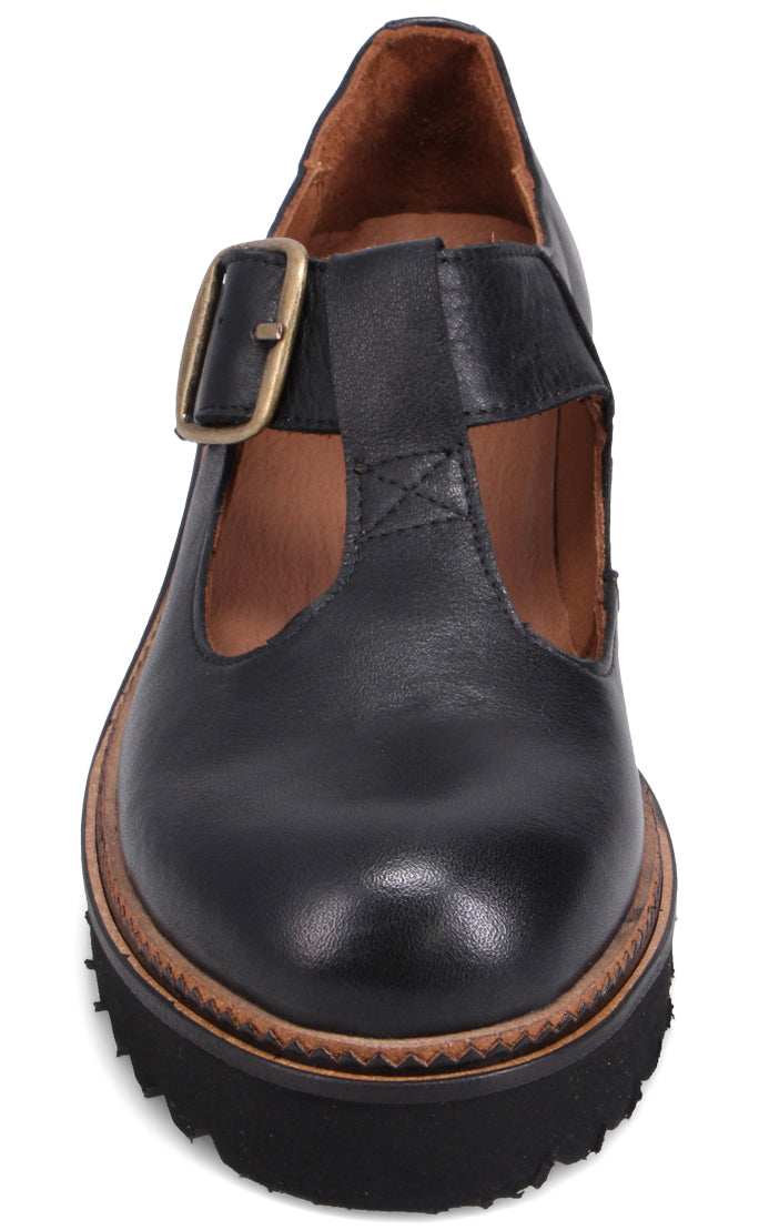 Black T-strap shoe with buckle and lug sole