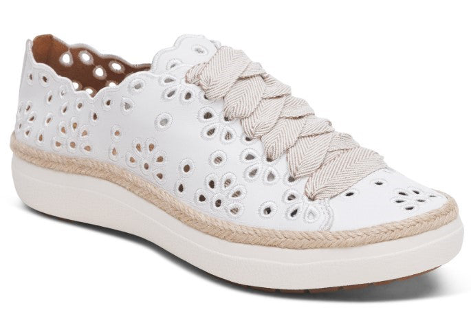 White lace-up sneaker with floral cutouts and espadrille trim.