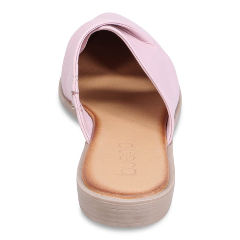 Pink slip-on shoe with light tan sole and insole showing the Joueio label.
