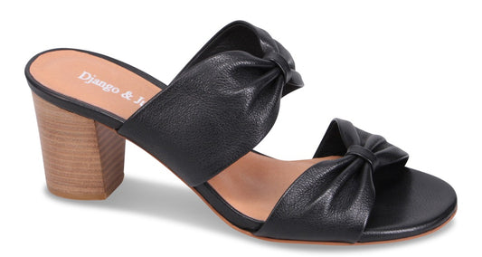 Black heeled sandal with knotted straps and wood block heel showing "Django & Juliette" on the insole.