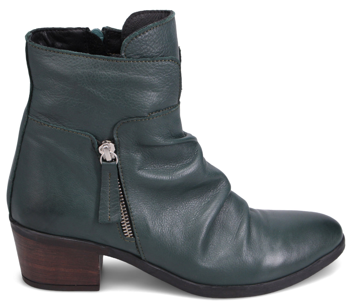 Green leather ankle boot with zipper and short heel.