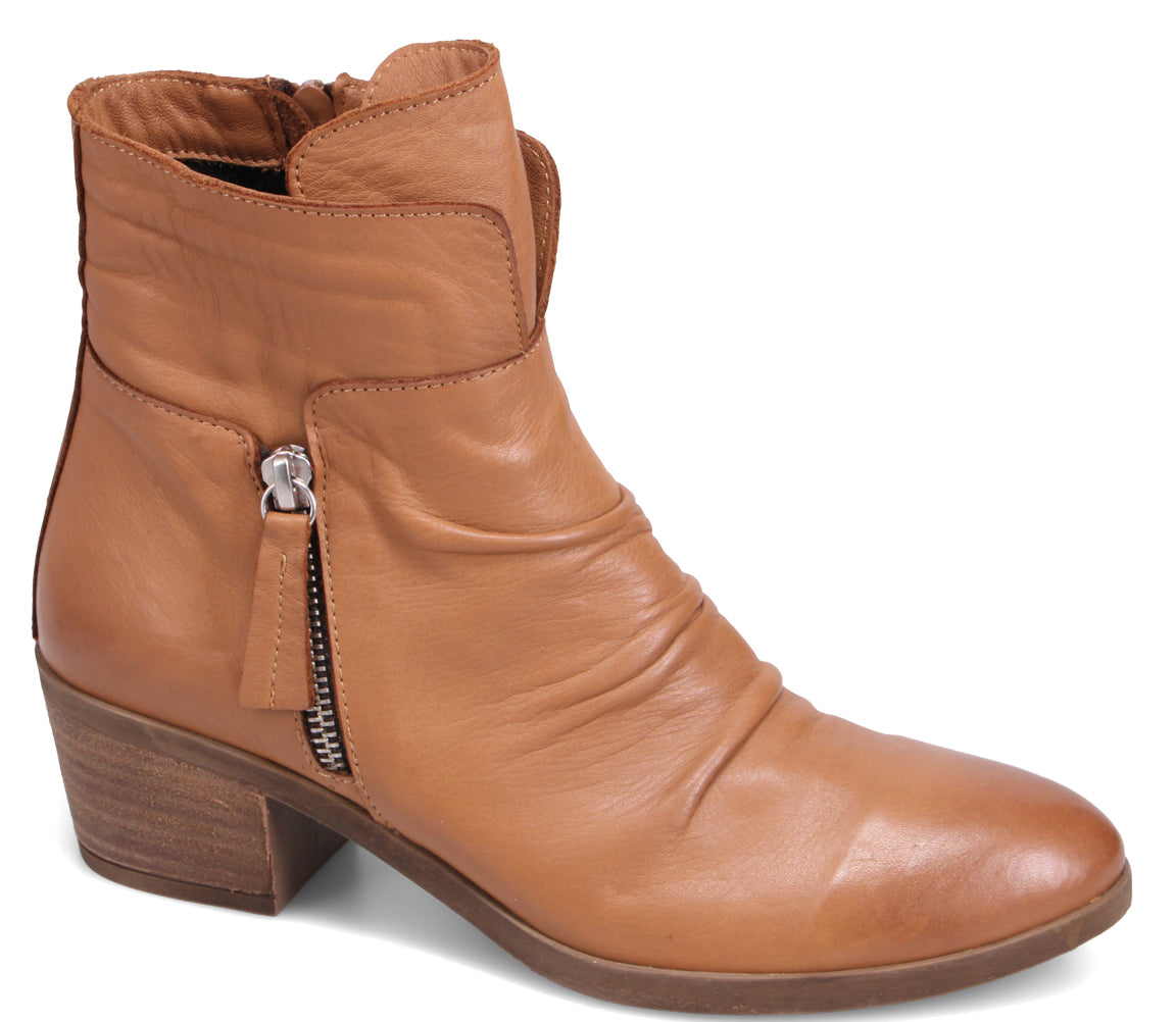 A light brown leather ankle boot with a side zipper and a stacked heel.