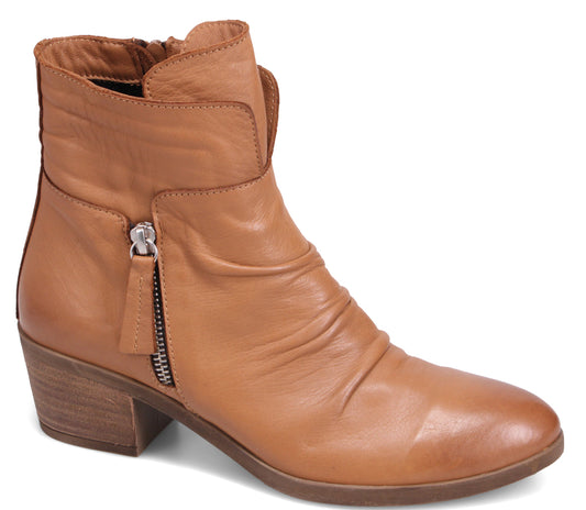 A light brown leather ankle boot with a side zipper and a stacked heel.