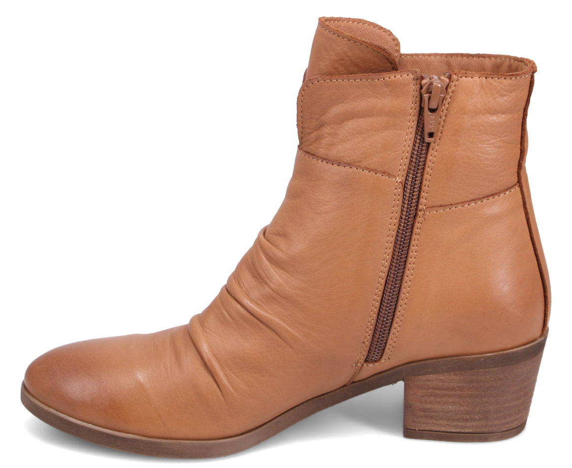Tan ankle boot with side zipper and short block heel.