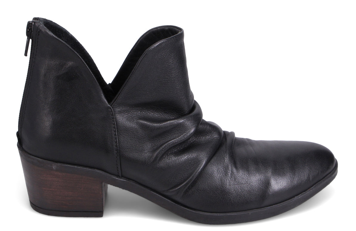 Black leather ankle boot with a block heel and a v-shaped opening.