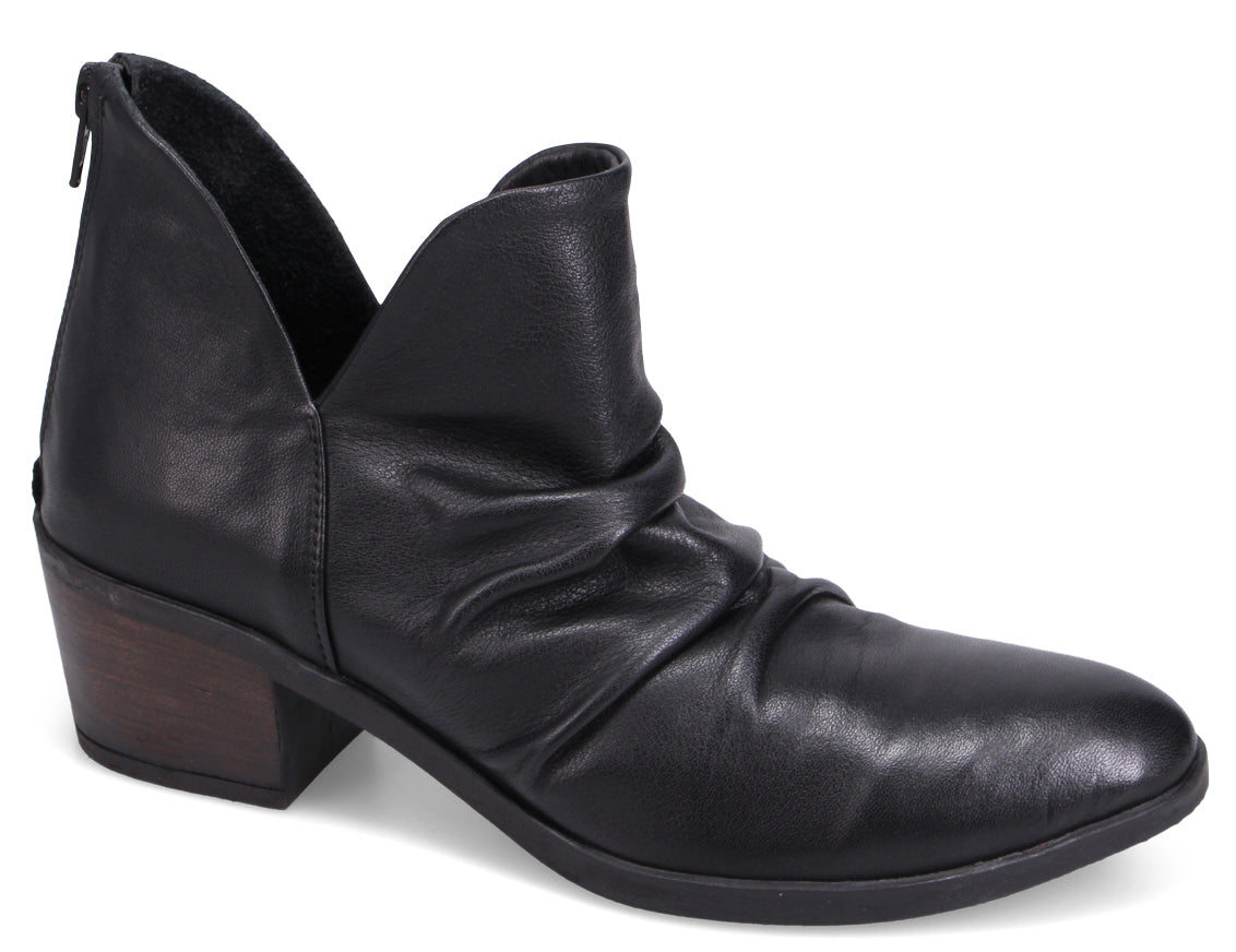 A women's ankle boot in black leather, with a low block heel, back zipper, and a v-shaped upper.