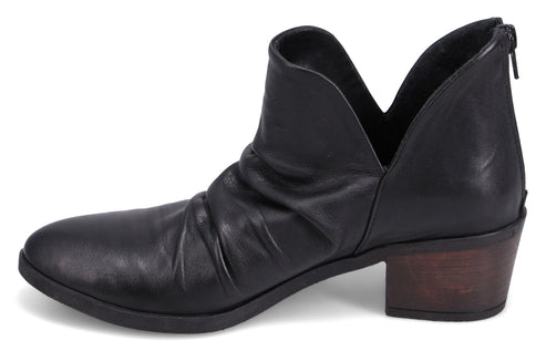 Black leather ankle boot with a short stacked heel, a V-cutout at the sides, and a back zipper.