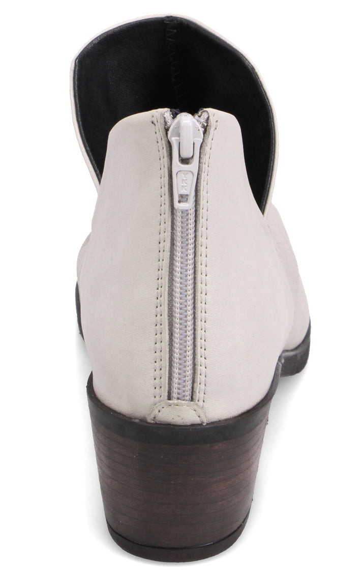 Back view of a light grey ankle bootie with a block heel and zipper.