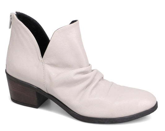 Ankle boot with a low block heel and a v-shaped opening.