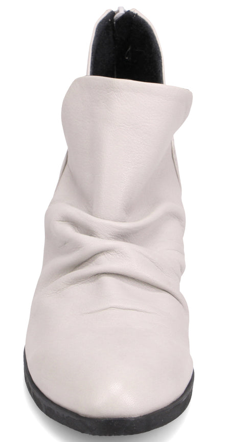 A light gray, wrinkled boot with a black sole and heel.