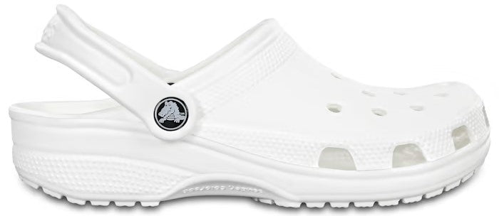 A white clog with a pivoting heel strap and a perforated upper.