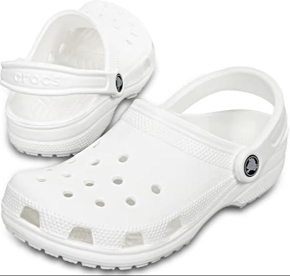 Pair of white clog shoes with heel straps and ventilation holes.