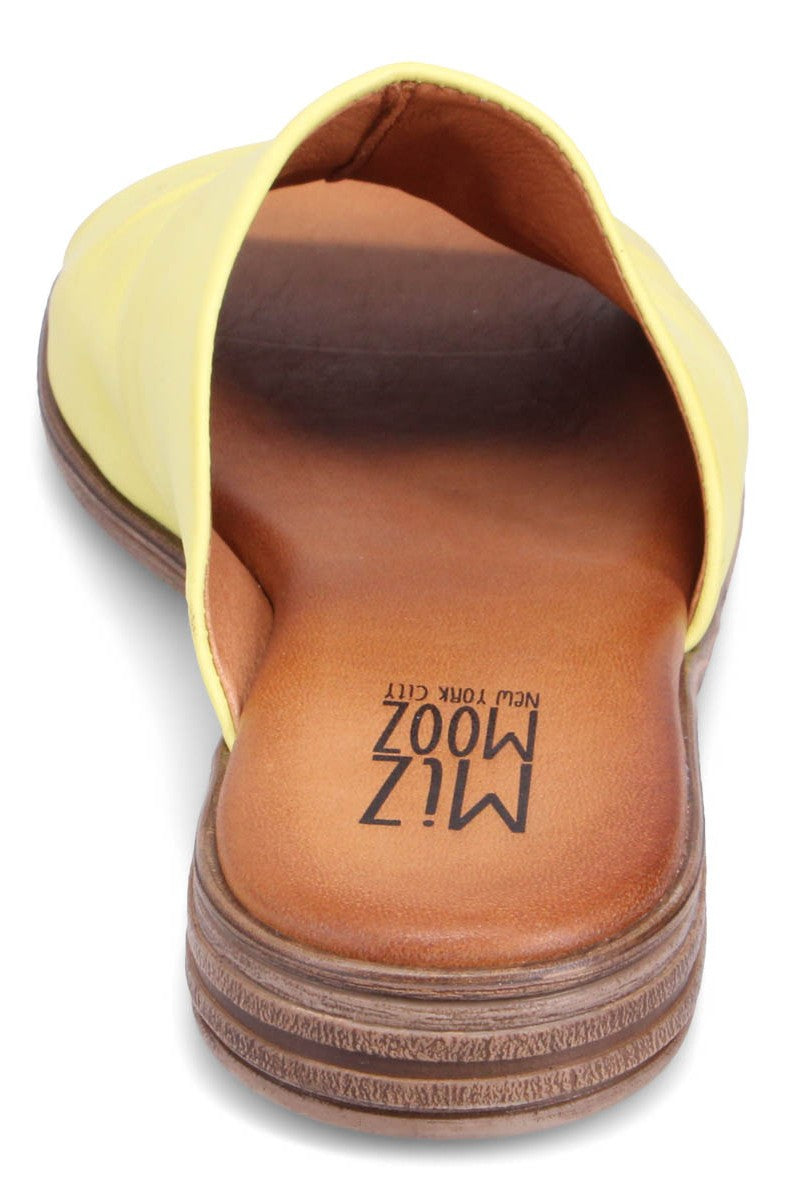 Yellow slide sandal with "MIZ MOOZ NEW YORK CITY" printed on the brown insole.