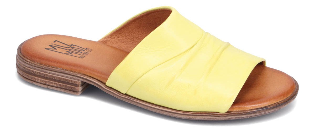 A yellow slide sandal with a stacked heel.