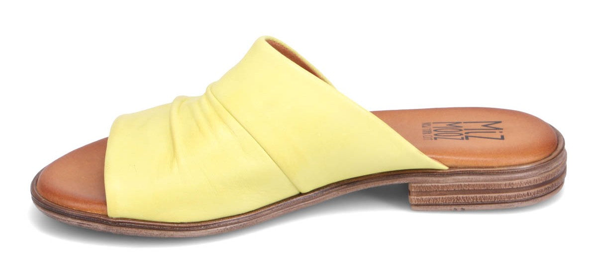 Yellow slide-on sandal with a gathered fabric upper and a low heel.