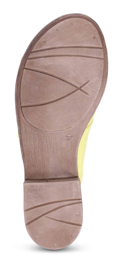 Sole of a shoe with a dark brown, textured design.