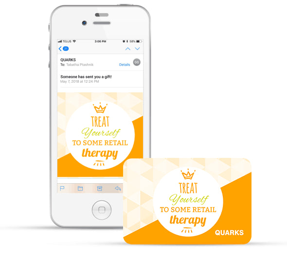 An illustration shows a mobile phone displaying an email with a gift card image and a physical gift card. The cards feature the phrase "Treat Yourself to Some Retail Therapy" with a crown graphic and the word "QUARKS".