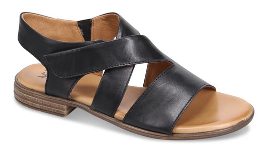 Black leather sandal with flat heel and crossover straps.