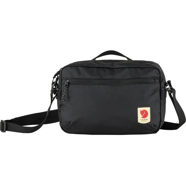 Black messenger bag with handle and logo.