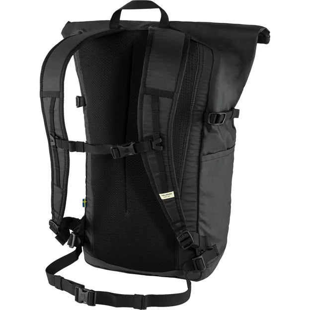 Back view of a closed black roll top backpack with padded shoulder straps and a ventilated back panel.