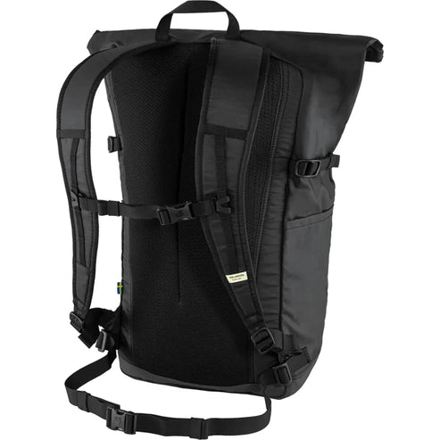 Back view of a closed black roll top backpack with padded shoulder straps and a ventilated back panel.