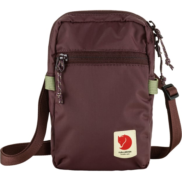 Plum-colored small nylon crossbody bag with front zipper pocket and logo patch.