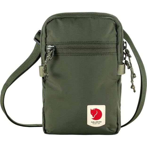 Green crossbody bag with a square, cream-colored logo featuring a red fox emblem.