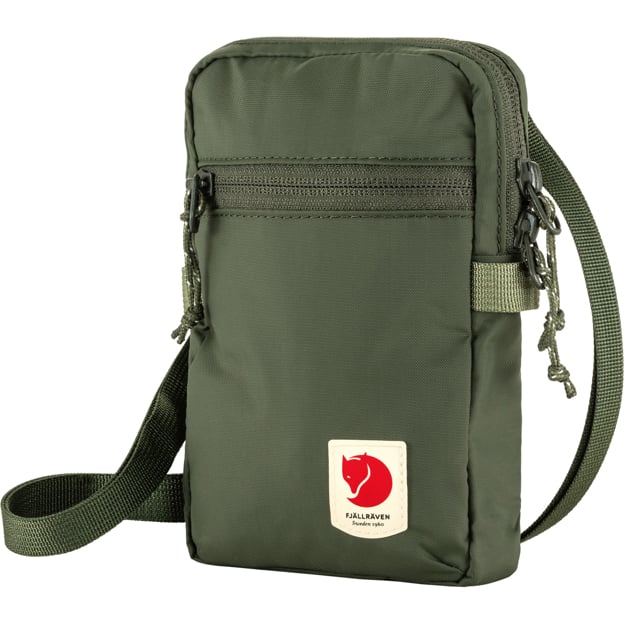 Olive green vertical bag with zipper and strap; a white rectangle with a red fox illustration and text at the bottom.
