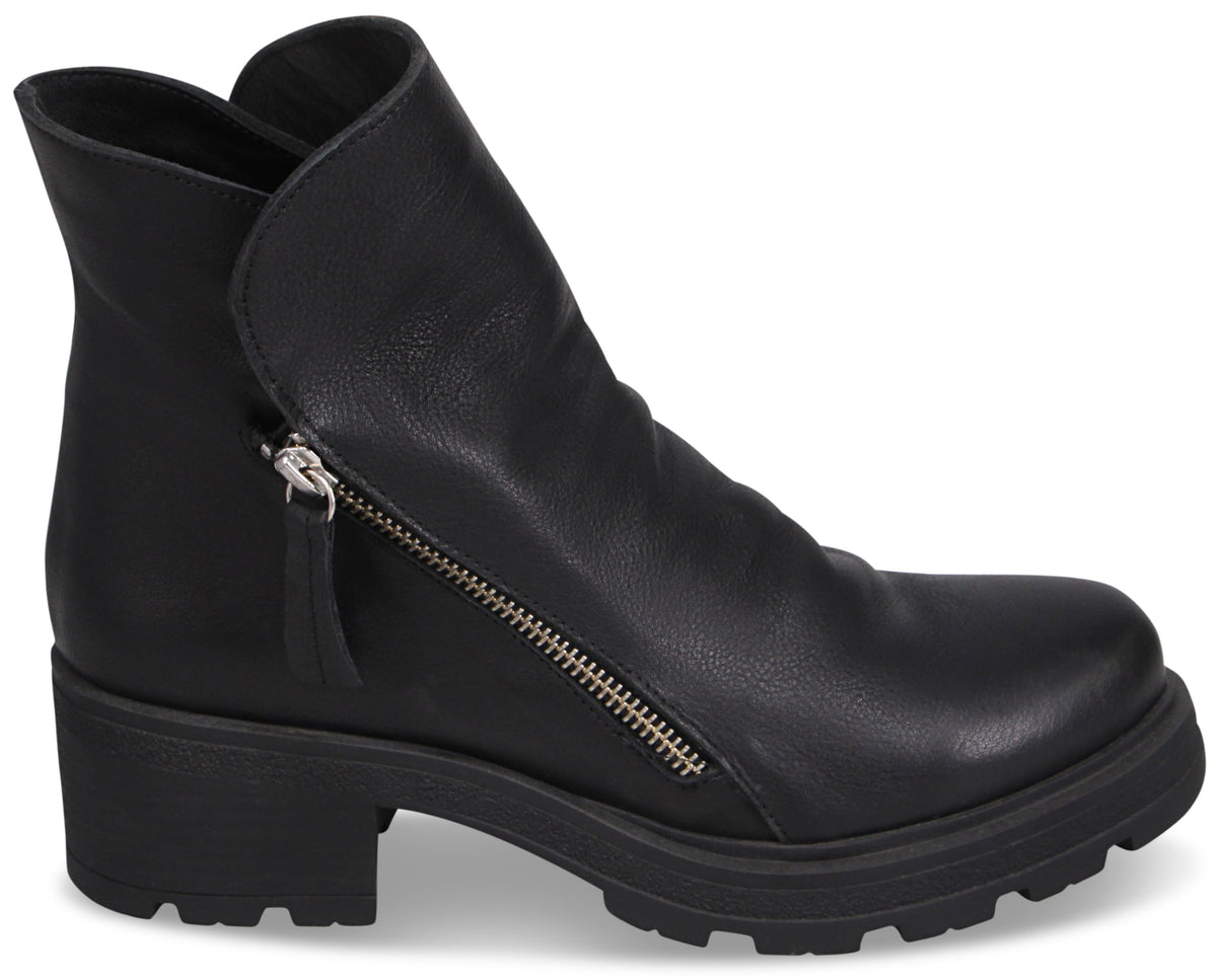 A black leather ankle boot with a rounded toe, a side zipper, and a thick, chunky lug sole.