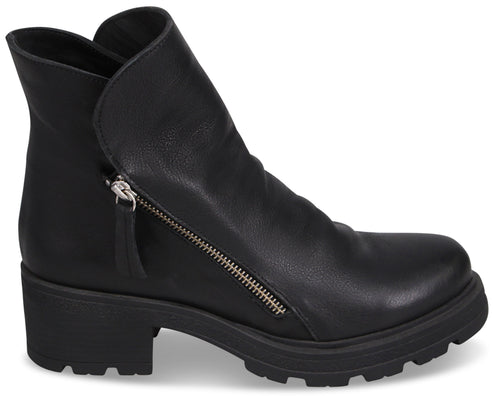 A black leather ankle boot with a rounded toe, a side zipper, and a thick, chunky lug sole.