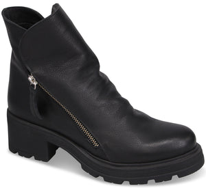 A black ankle boot with a block heel, a thick lug sole, and a decorative diagonal silver zipper on the outer side.