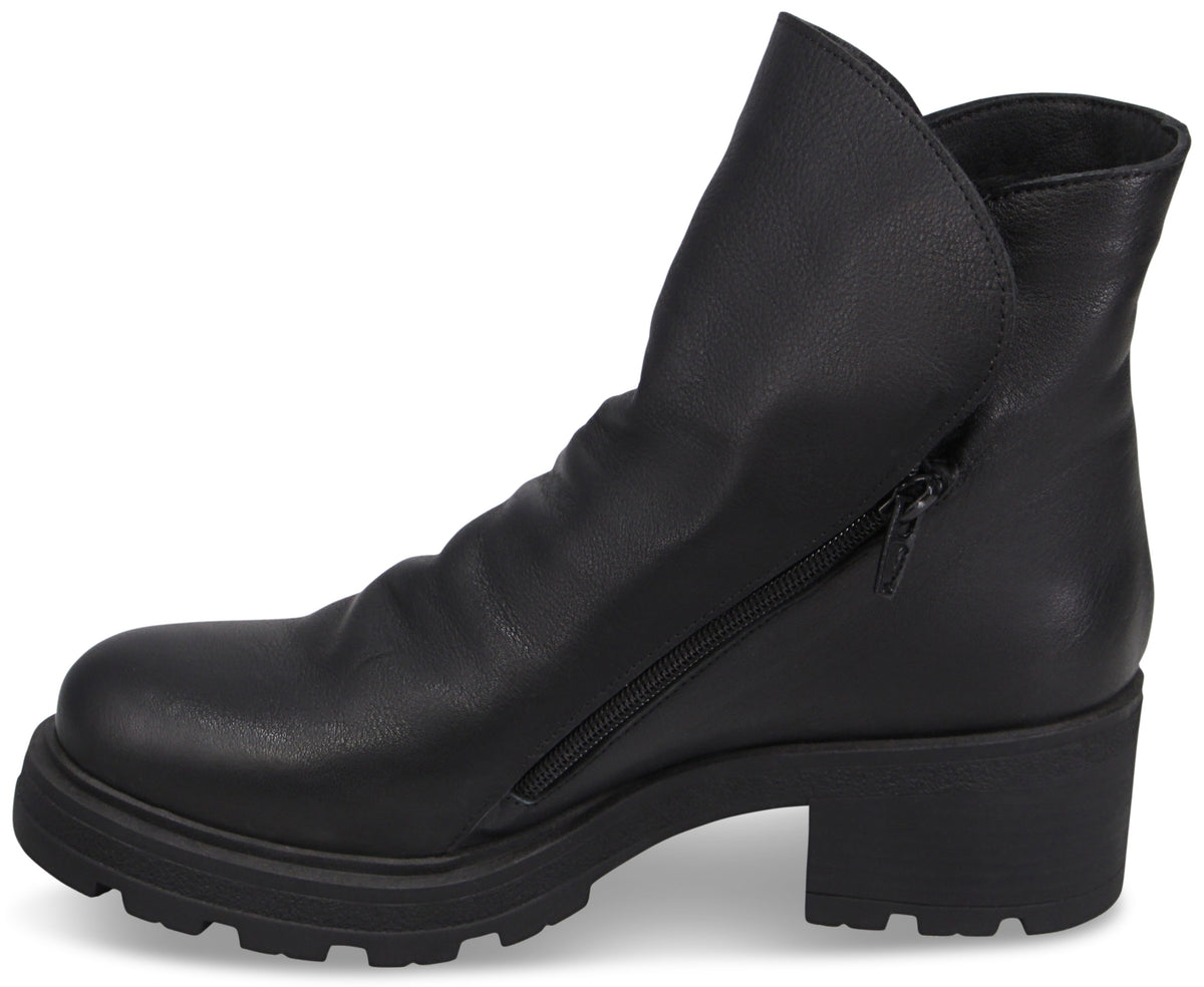 A black ankle boot with a rounded toe, a thick lug sole, a low block heel, and a side zipper closure, viewed from the side.