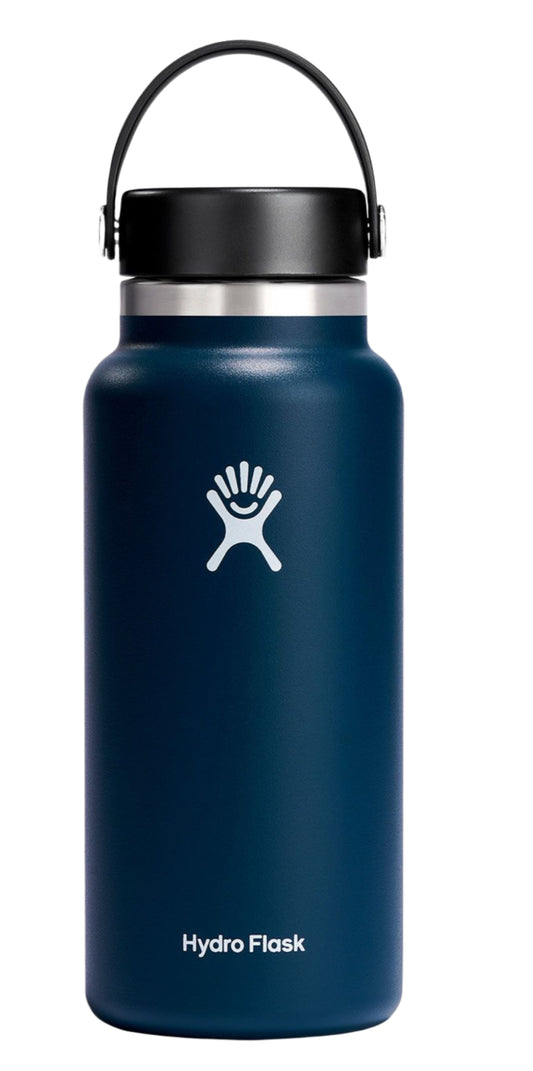 A blue Hydro Flask water bottle with black cap and handle.