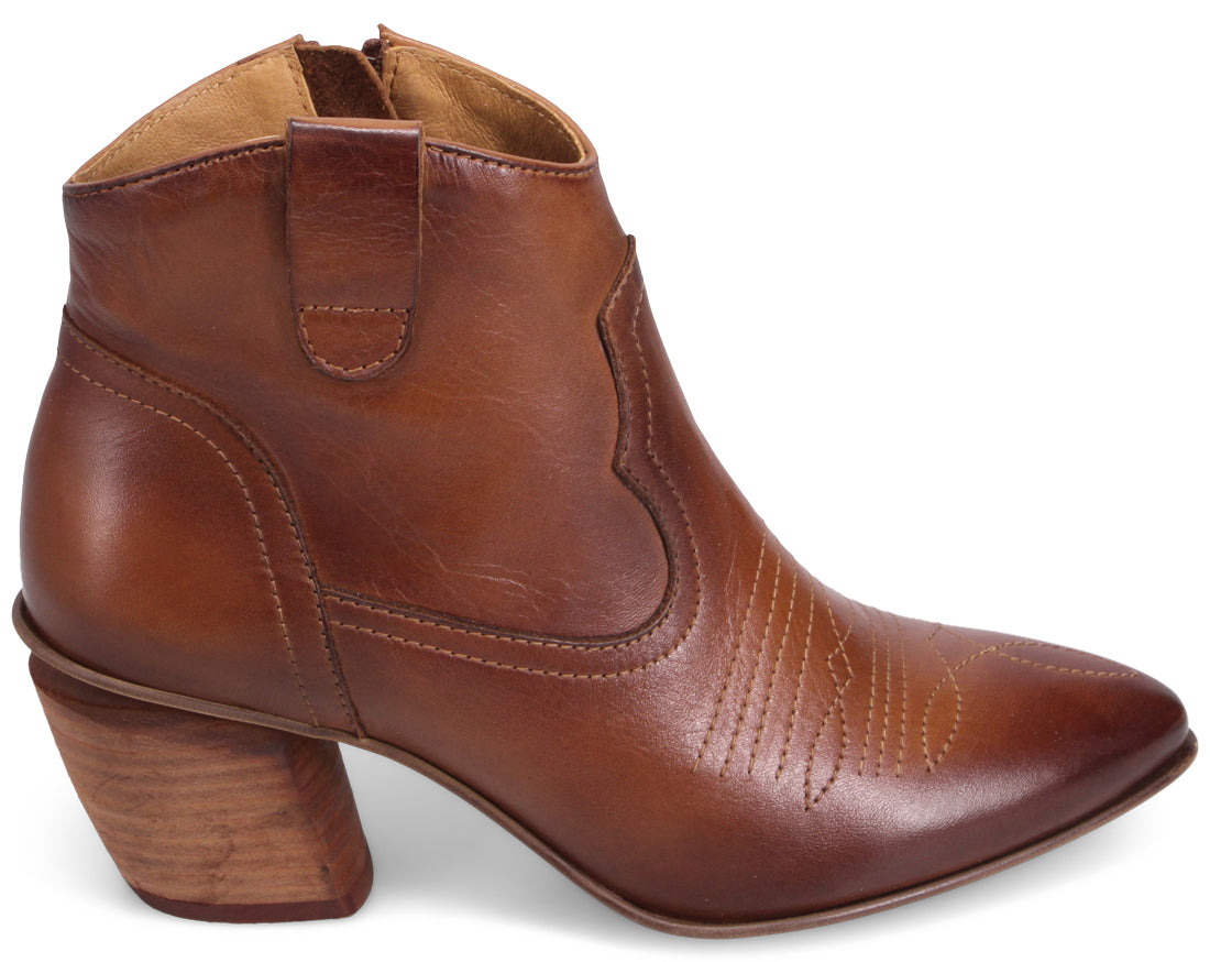 Brown leather heeled cowboy boot with pointed toe.