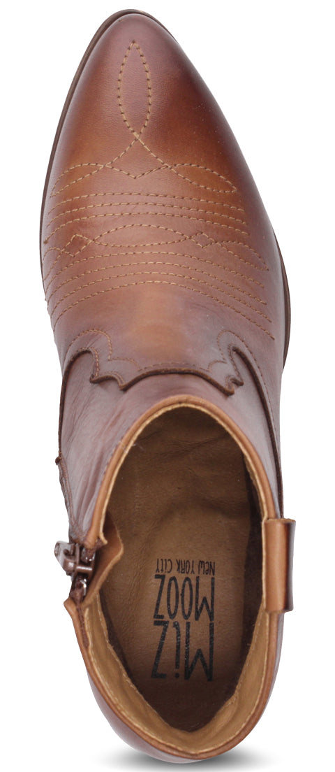 A brown leather ankle boot with a pointed toe and decorative stitching.