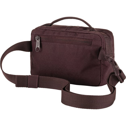 A plum-colored fabric waist bag with a buckle and zipper closure.