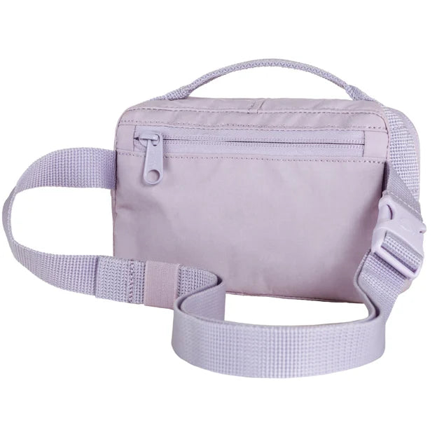 Lilac belt bag with adjustable strap and top handle.