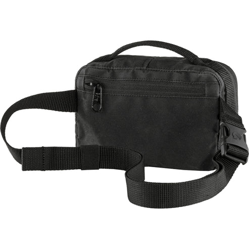 A black fabric fanny pack with a top handle and a zipped front pocket.