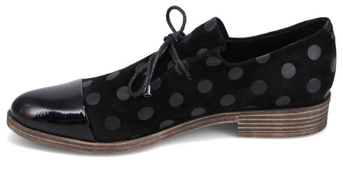 Black polka dot dress shoe with a patent leather toe.