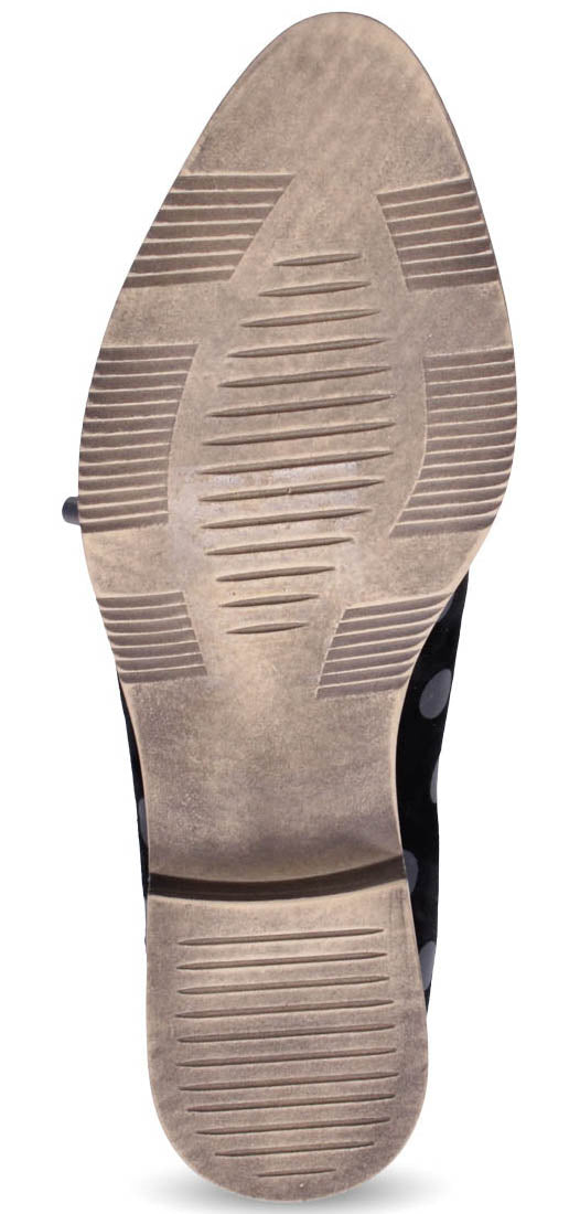 Sole of shoe with linear tread.