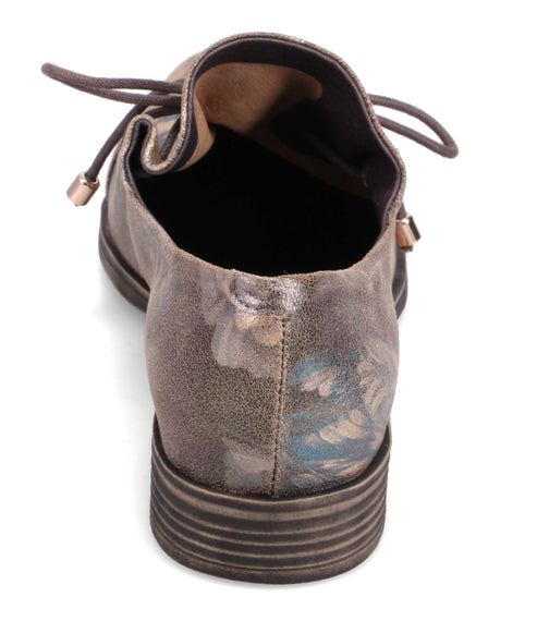 Low-heeled brown lace-up shoe with floral print on the back.