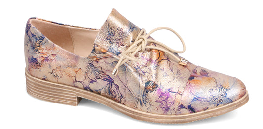 Floral-patterned beige oxford shoe with lace-up closure.