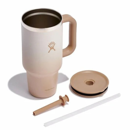 Insulated mug with handle, lid, rubber stopper, and straw.