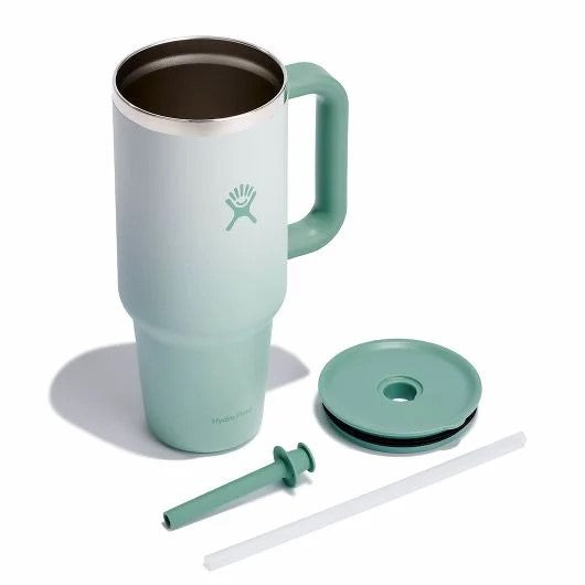 Gradient light green tumbler with handle, straw, lid and short straw.